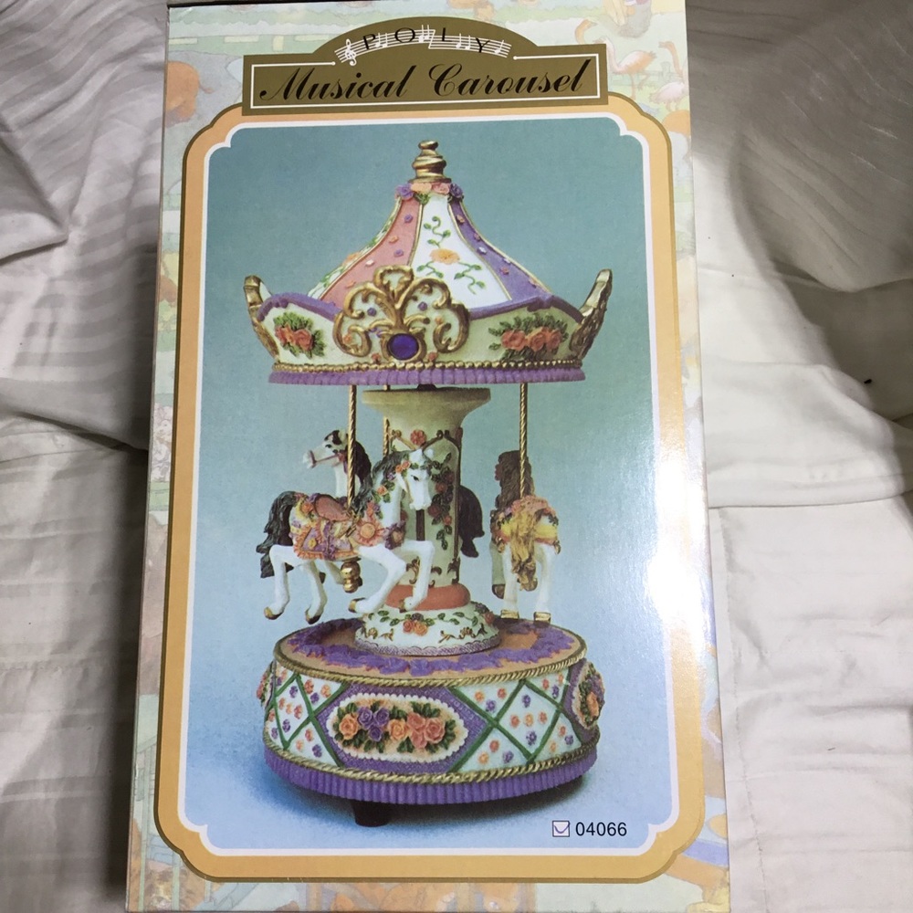 Poly musical carousel, NWT, plays Waltz, approx 10” by 5”dia, lovely gift
